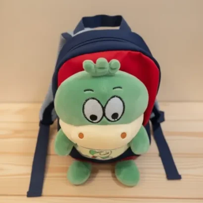 Mochila con peluche dinosaurio para niño