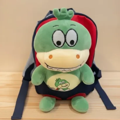 Mochila con peluche dinosaurio para niño