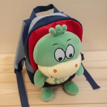 Mochila con peluche dinosaurio para niño