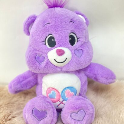 Peluche osito cariñosito en lila, rosa y azul