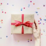 crop-hand-holding-present