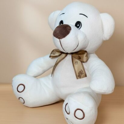 peluche osito blanco con lazo dorado