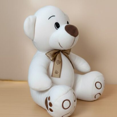 peluche osito blanco con lazo dorado