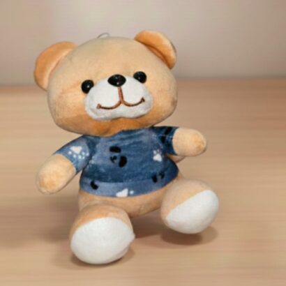 peluche osito con ropa azul y estampado de panda